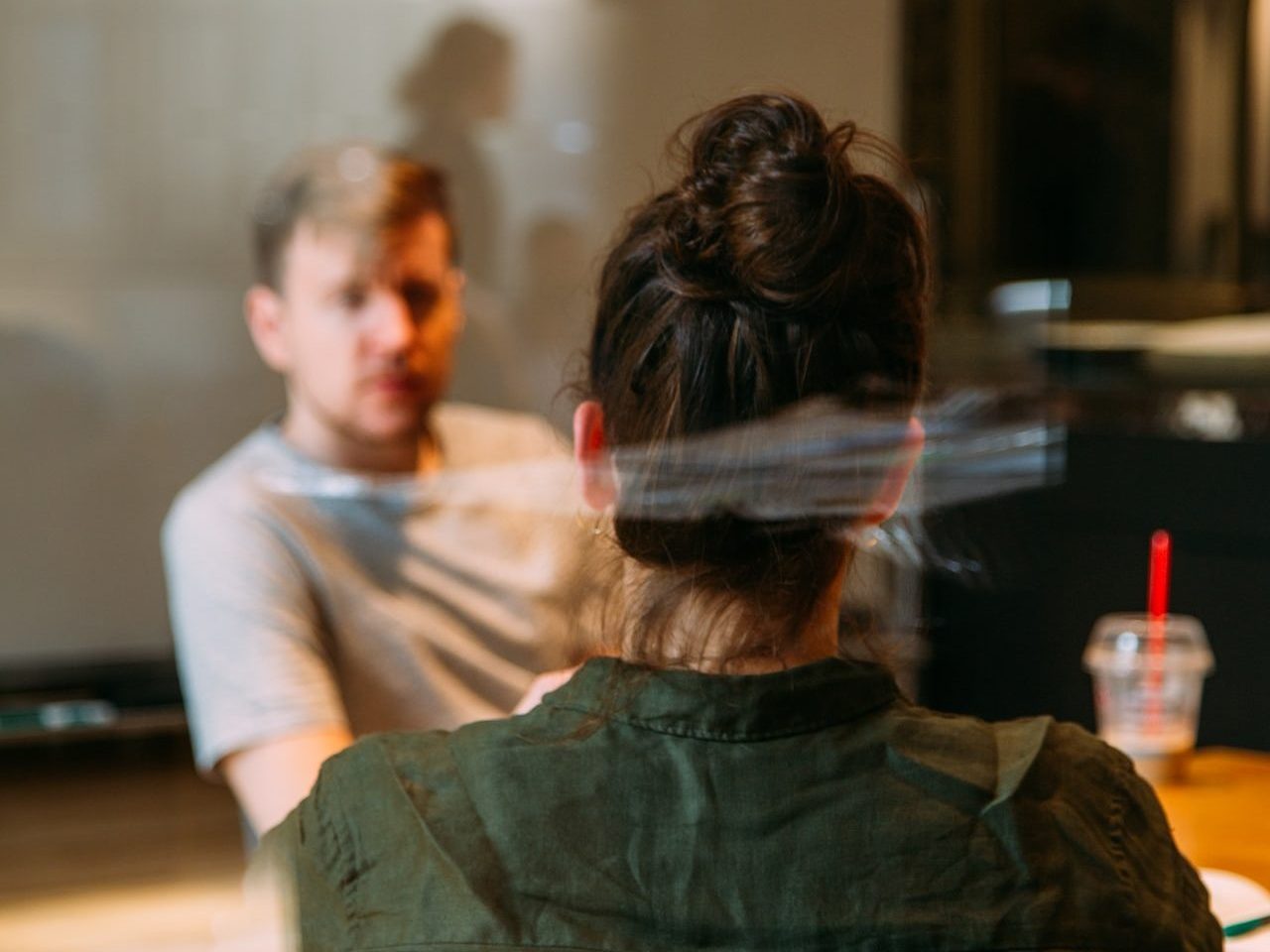 person sitting in a chair in front of a man